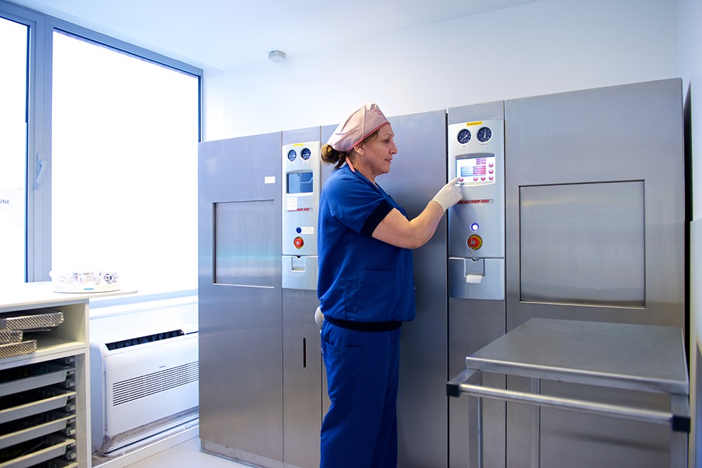 One of our nurses sterilizing surgical equipment at o2 Clinic.